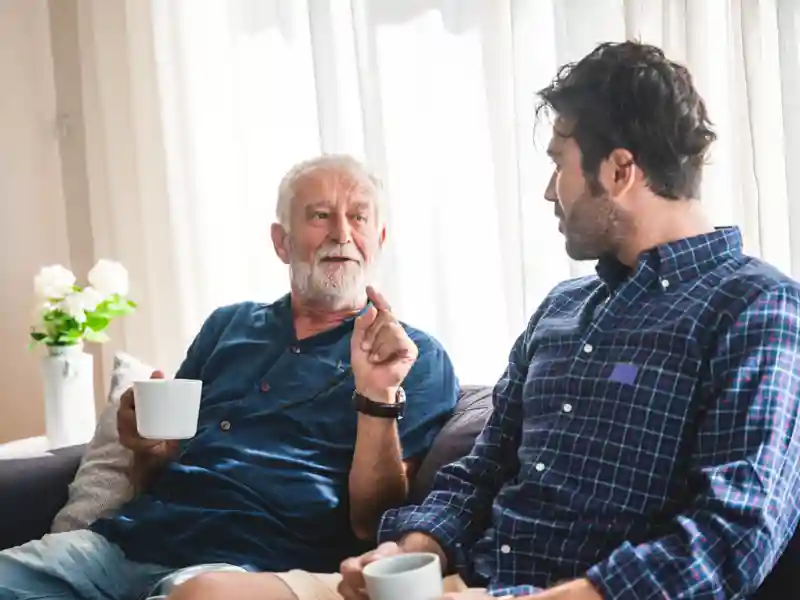 Father and son on a couch.
