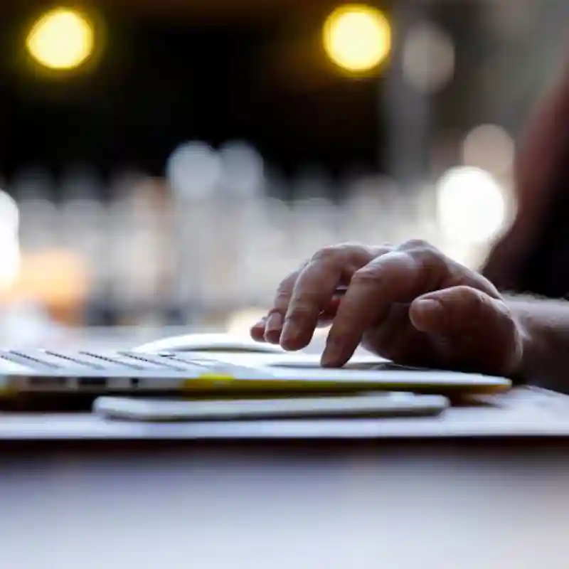 Male hand using laptop